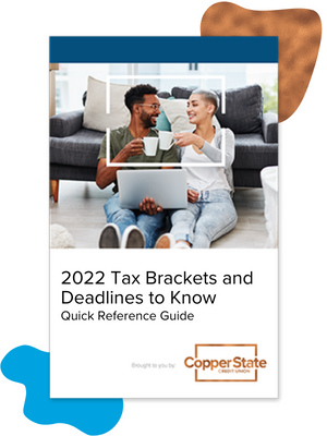 2022-tax-brackets-couple-with-coffee-on-computer