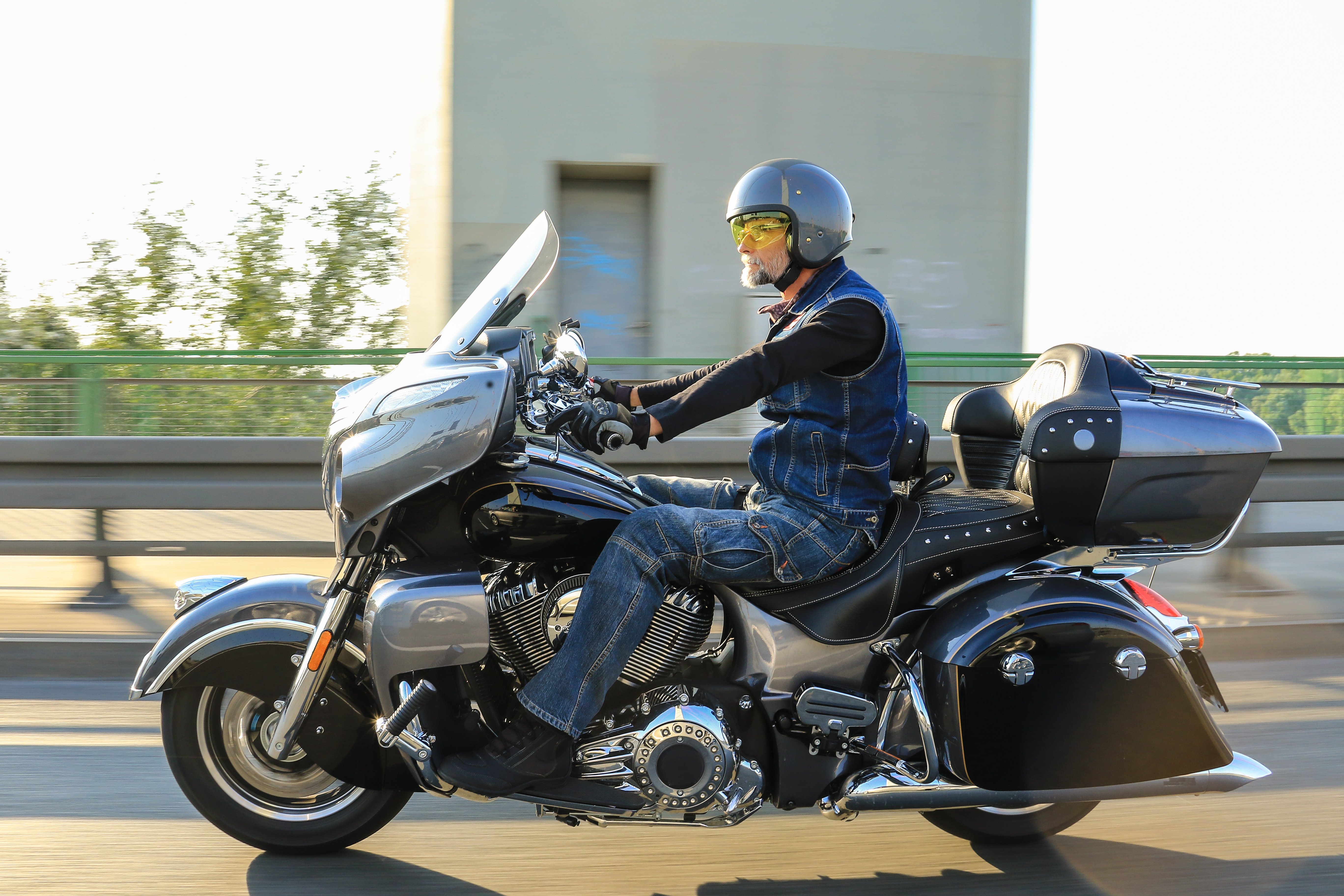 Man riding a touring motorcycle on a highway