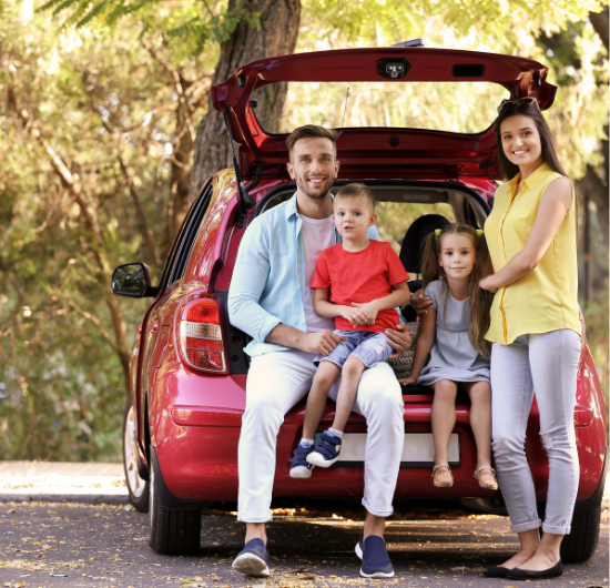 Family sitting in their car