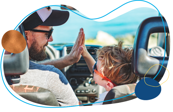 dad and son high five in car