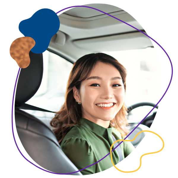Smiling woman in a car