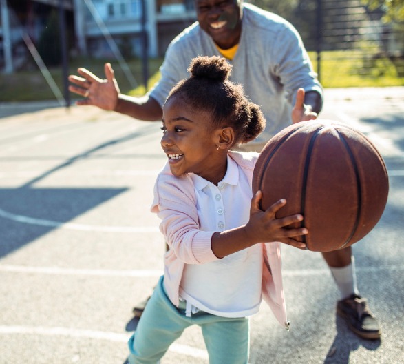 grandfather-and-granddaughter-playing-basketball