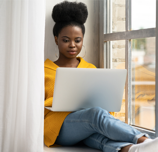 woman on herl laptop taking financial education course