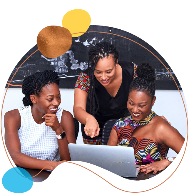 Three woman reviewing a Commercial Mortgage on a laptop.