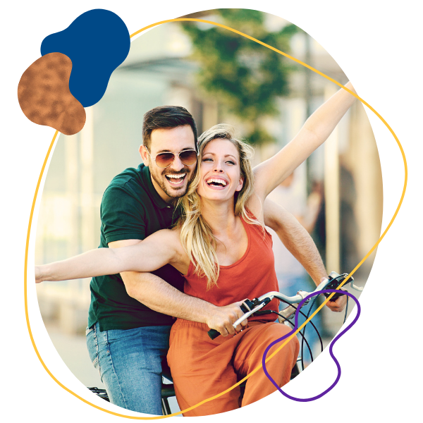 Happy Couple Riding A Bike 