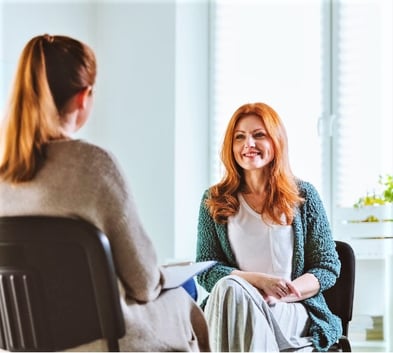 smiling-woman-with-a-counselor