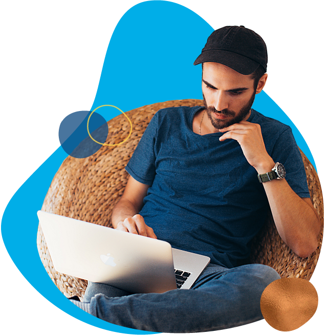 man on laptop in chair