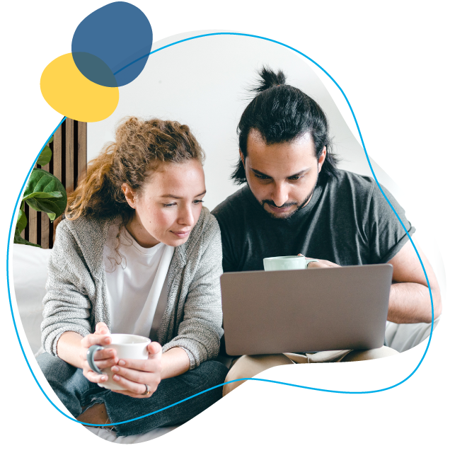A couple on laptop looking for a debt consolidation loan.