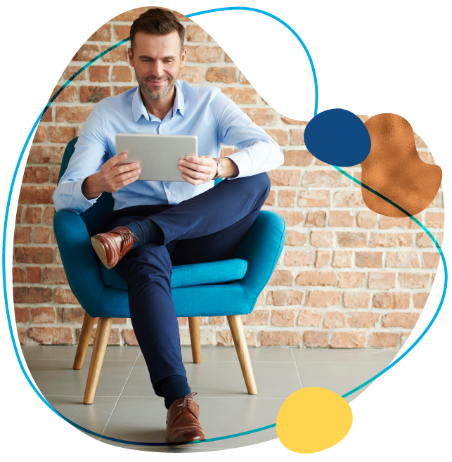 man on tablet with brick background