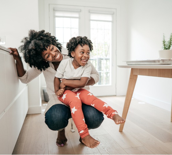Mother an child in house after getting a mortgage.