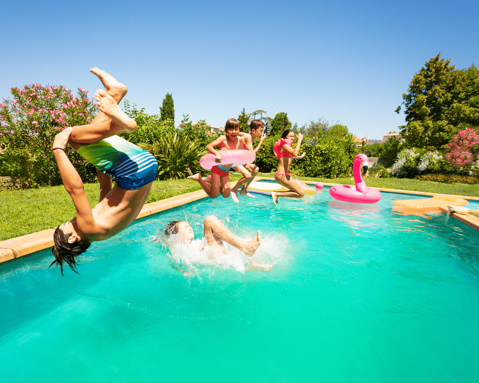 Kids jumping in a pool