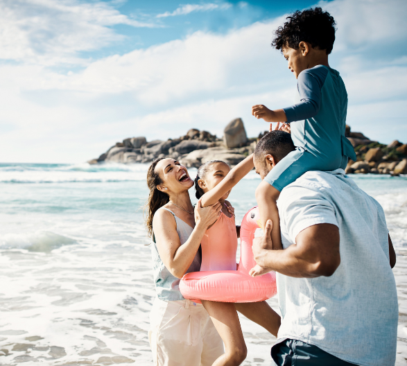 Family together at the beach enjoying a vacation