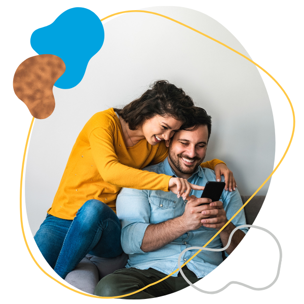 Two people looking at their cell phone