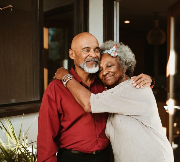 smiling-elderly-woman-embracing-husband
