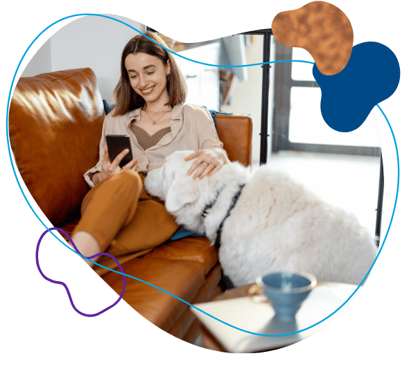 Woman on couch using her phone