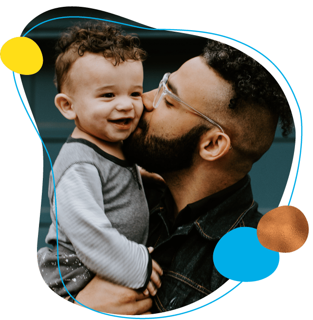 dad kissing son