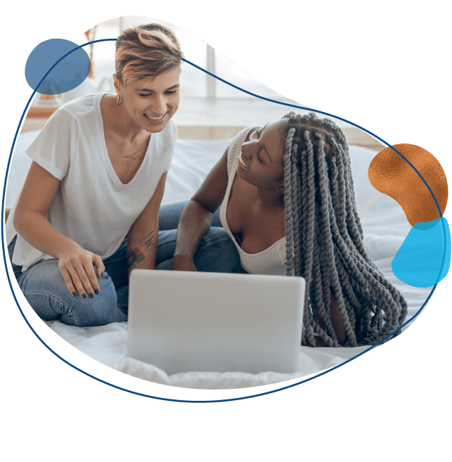 women couple on a laptop