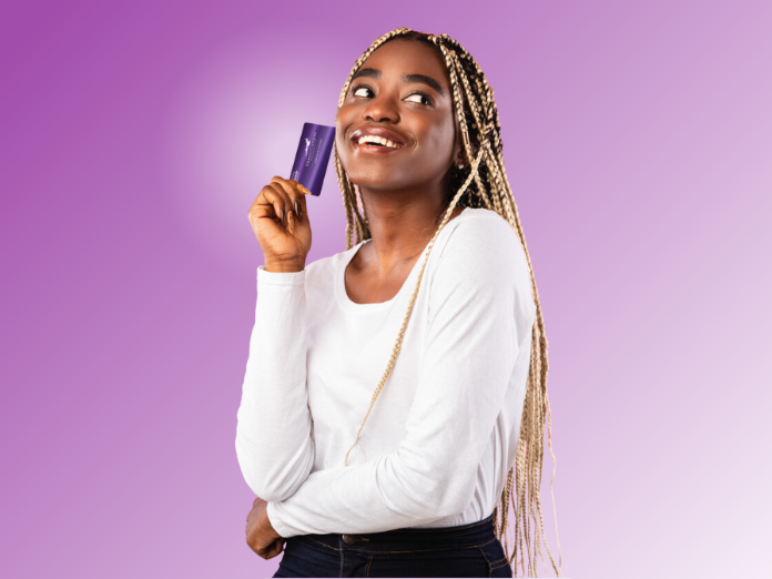 Woman holding a GCU Debit Card (1)