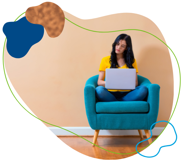 Woman on computer sitting in a chair