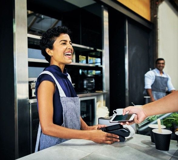 business owner ringing up customer