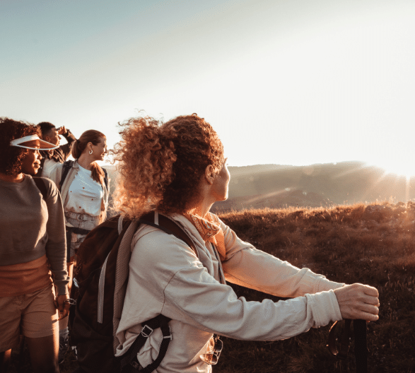 Women hiking talking about cashback checking accounts