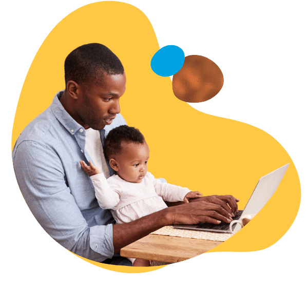 father and child using laptop