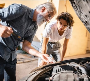 grandson-repairing-the-car-with-his-grandfather