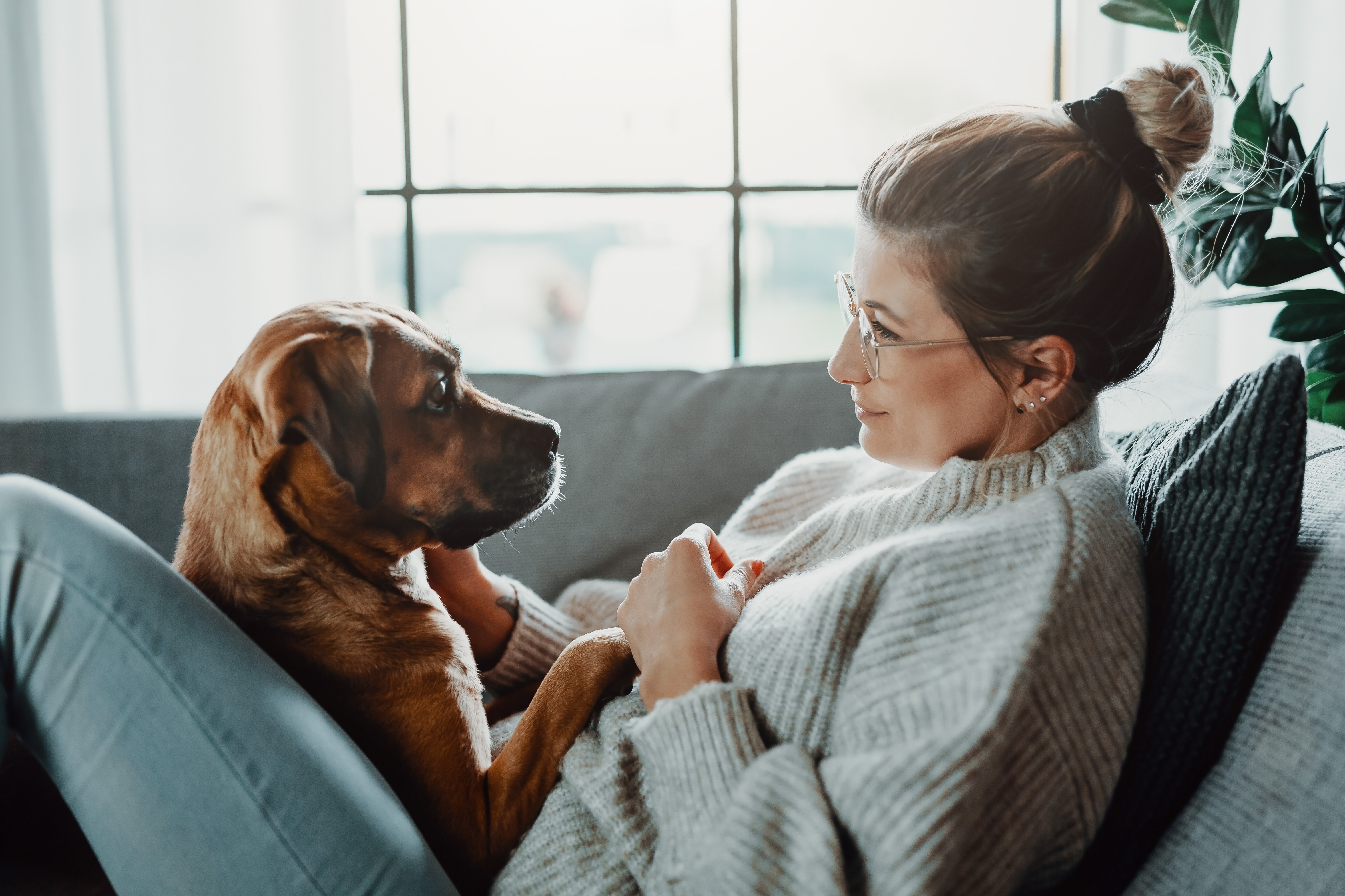 girl with dog on couch