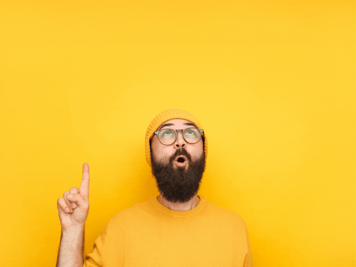 Guy in yellow hat in front of yellow wall