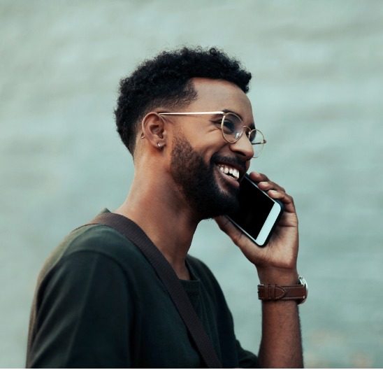 Man Walking and Talking on the Phone Smiling