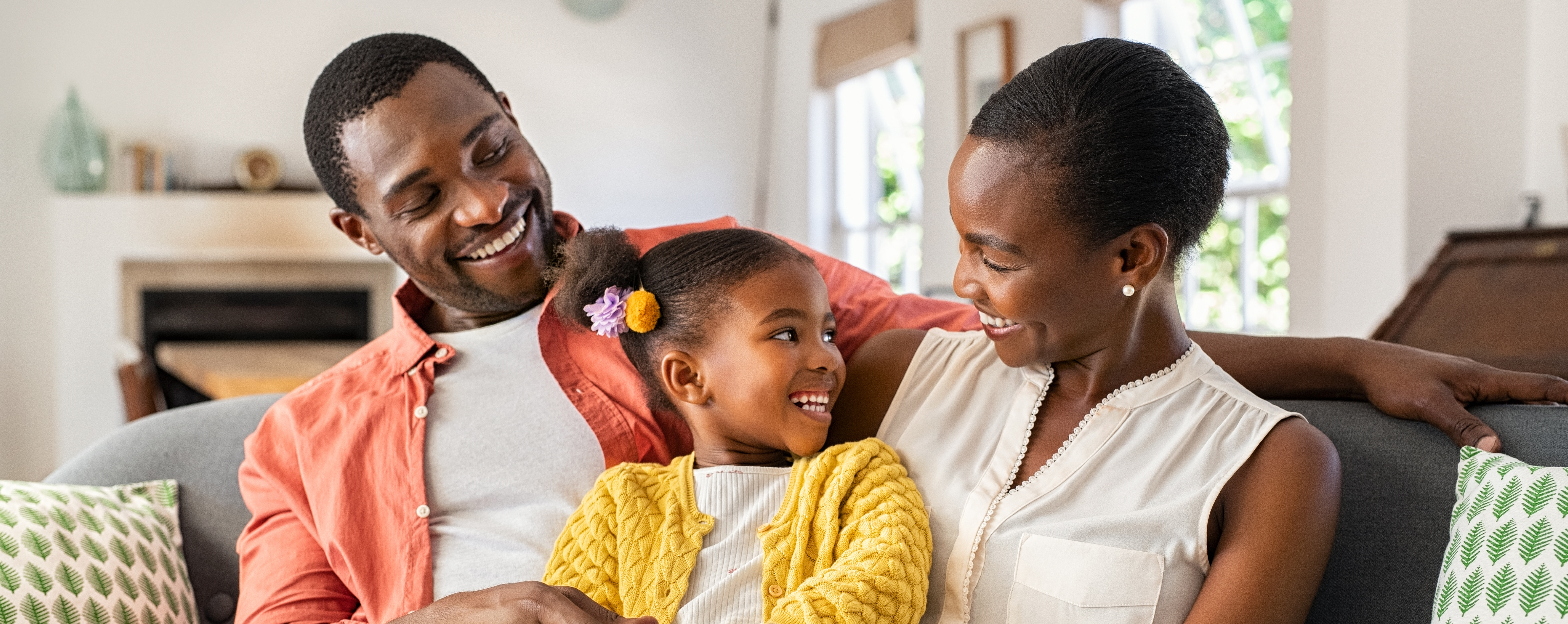 A happy family spends time together after consolidating debt.