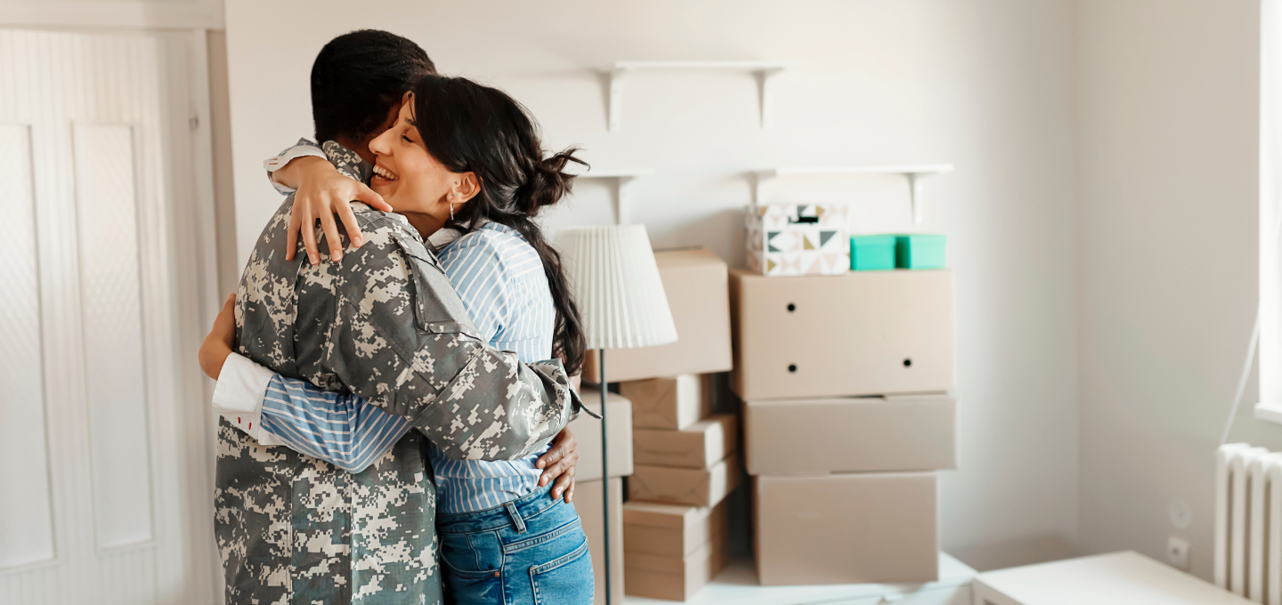 wife-embraces-veteran-husband-while-moving-into-new-home