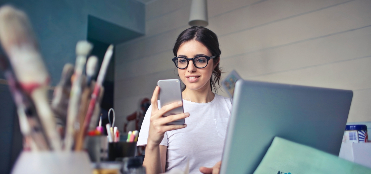 girl on phone and computer