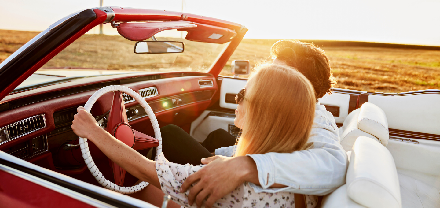 couple-driving-in-convertible-car