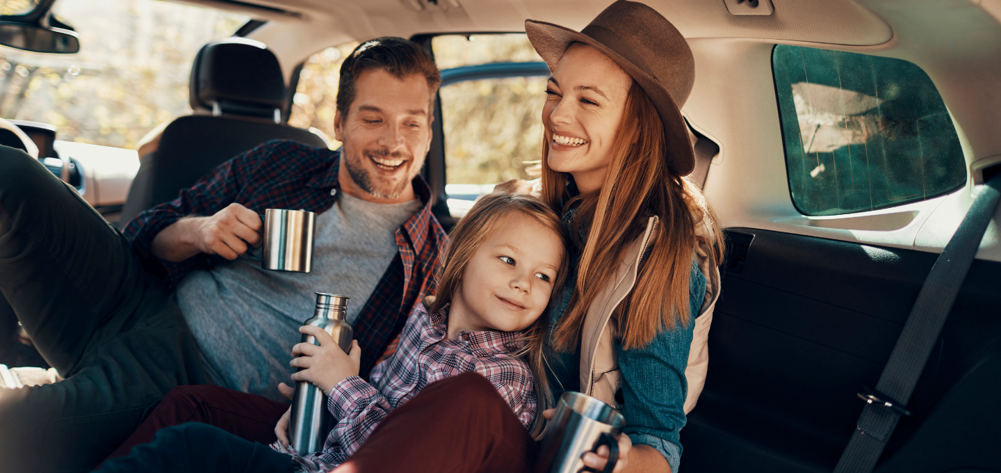 family-laughing-inside-of-car