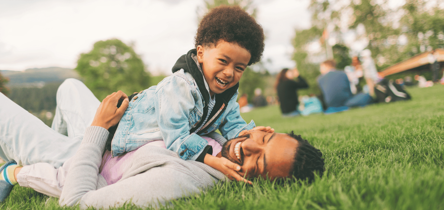 father-and-son-playing-in-grass